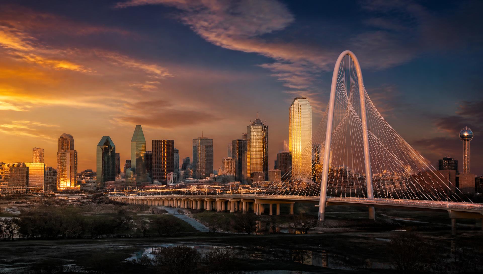 The Margaret Hunt Hill Bridge and the Dallas skyline at golden hour
